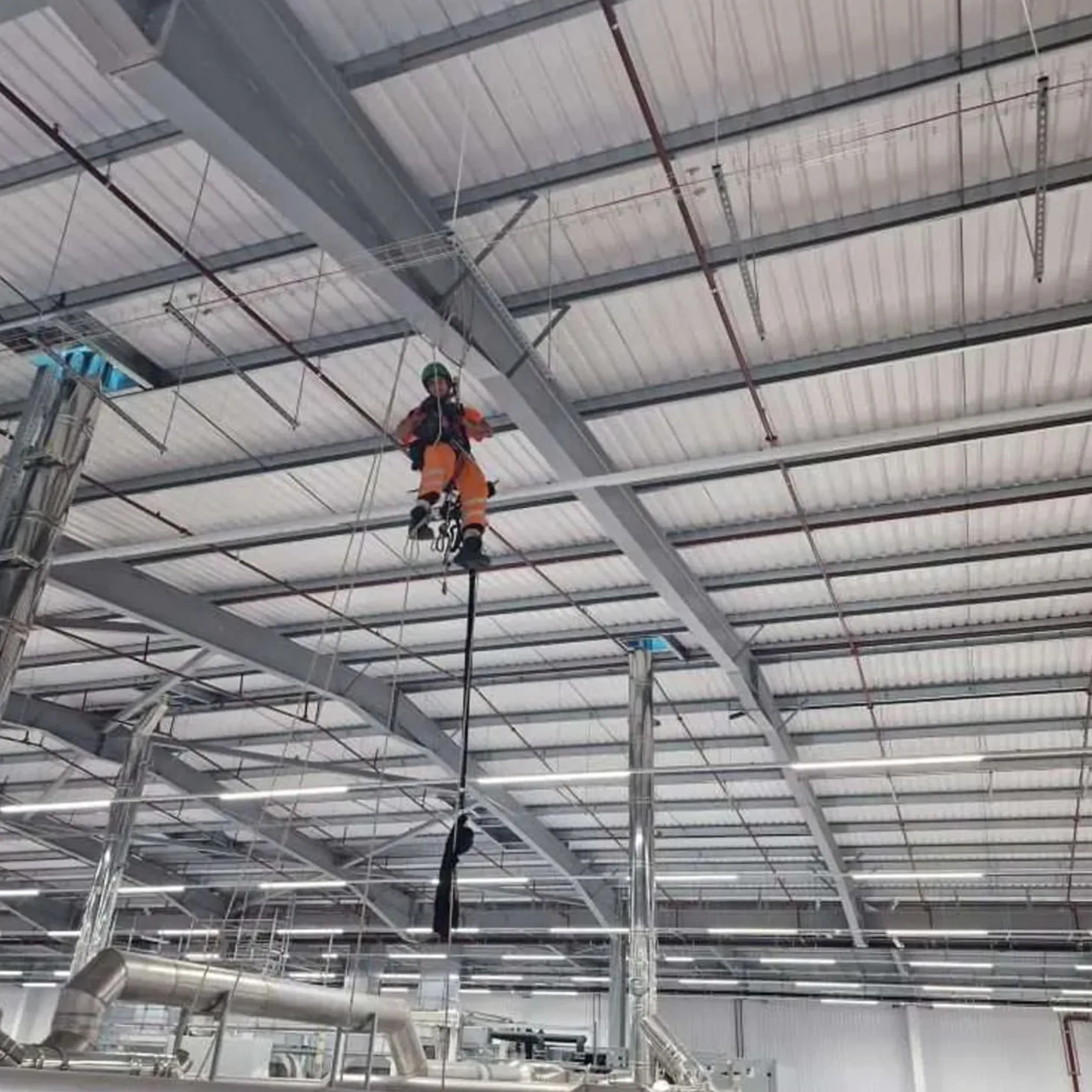 rope access worker using elevated gear